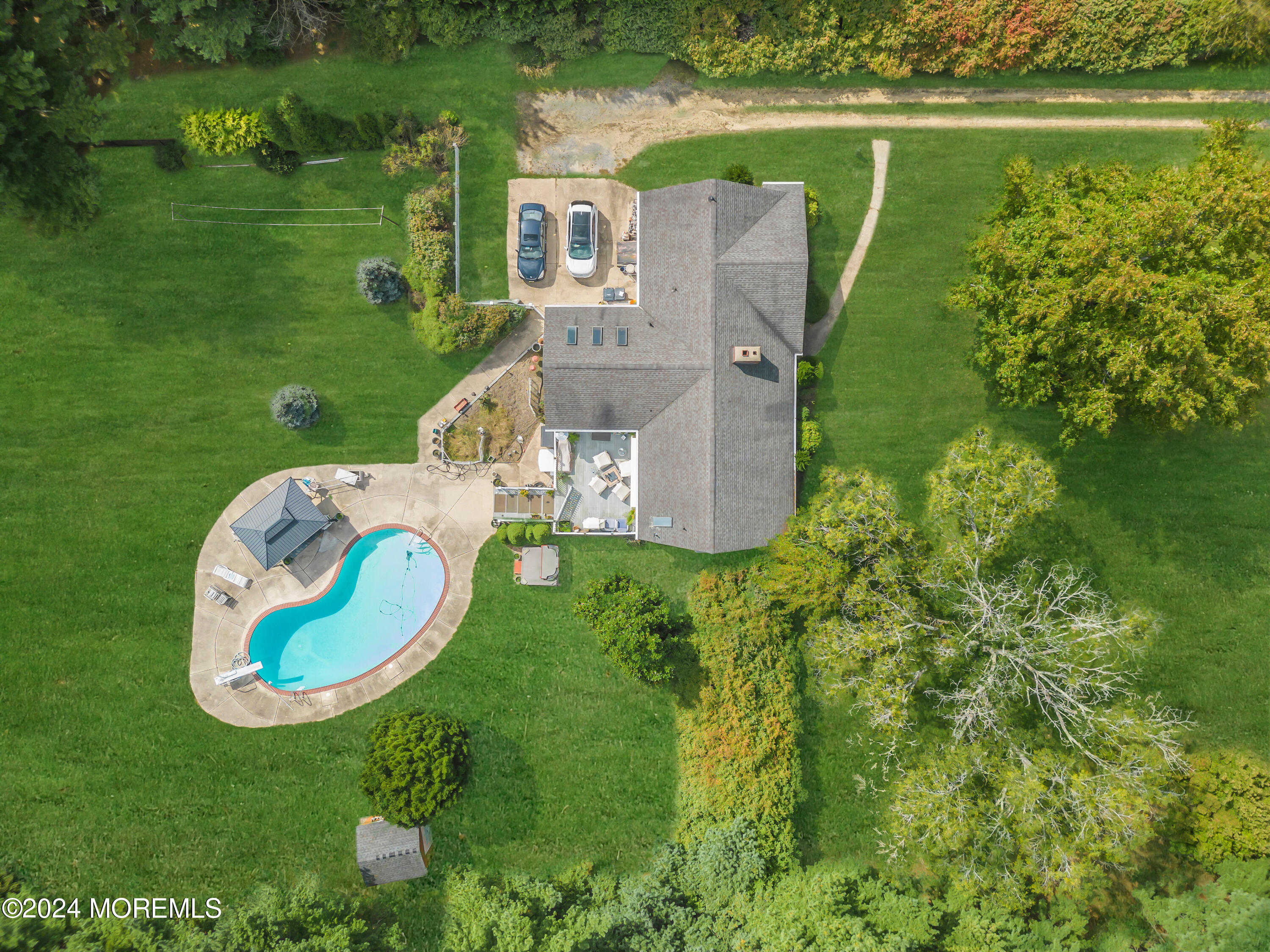 1521 Silverton Road Toms River, NJ 08755 - Photo 45 of 59 an aerial view of a house with a garden and lake view