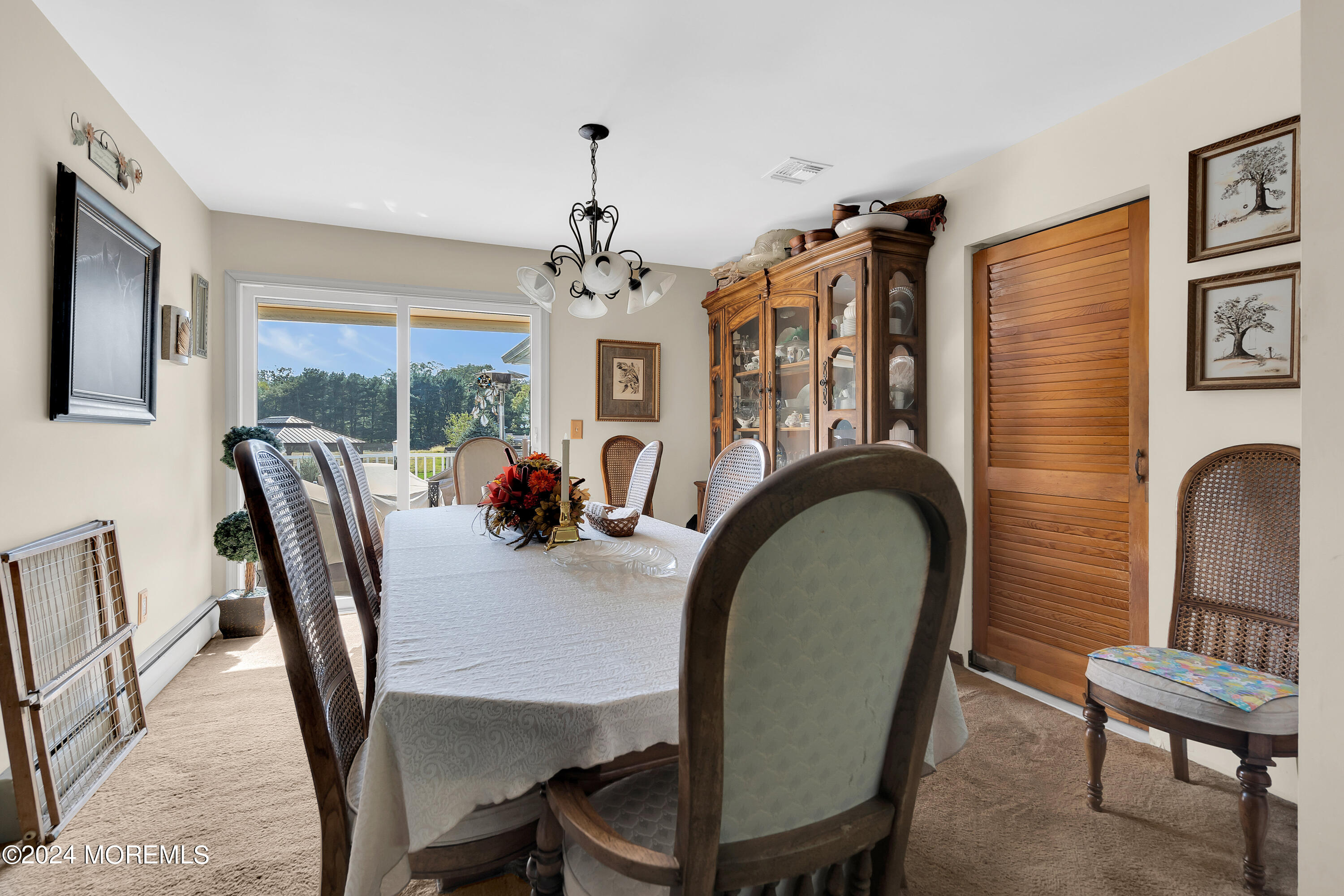 1521 Silverton Road Toms River, NJ 08755 - Photo 8 of 59 a view of a dining room with furniture and chandelier