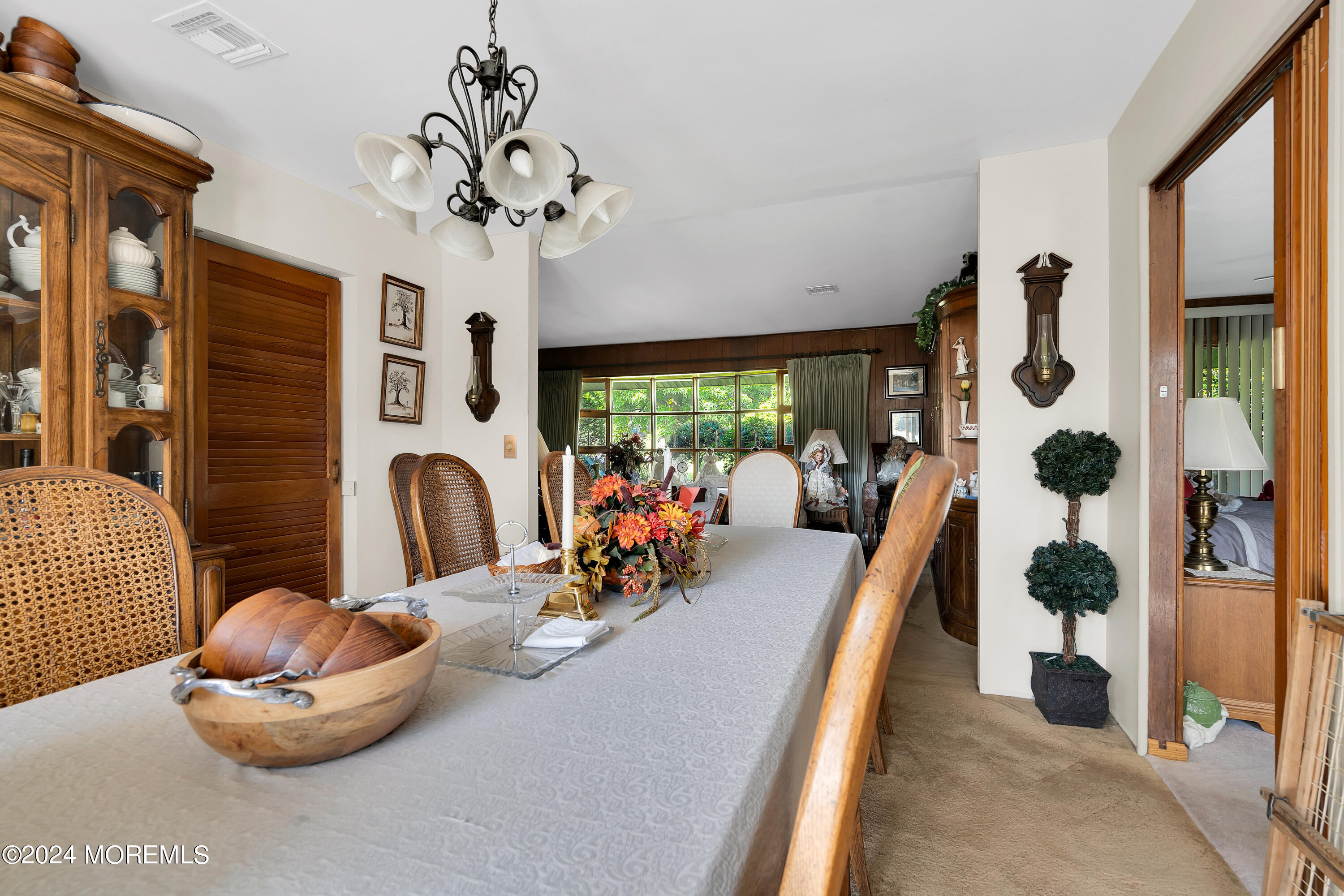 1521 Silverton Road Toms River, NJ 08755 - Photo 9 of 59 a view of a dining room with furniture a chandelier and large windows