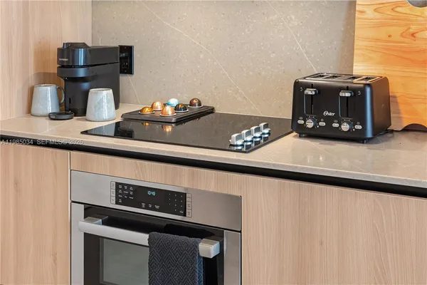 a kitchen with a stove and a microwave