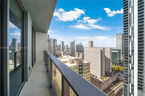 a view of a balcony with seating area