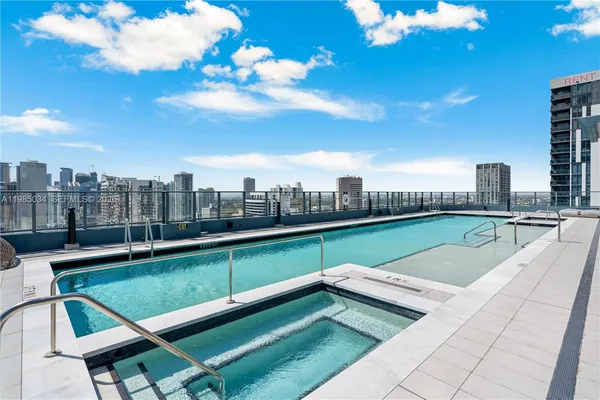 a view of a swimming pool with a terrace