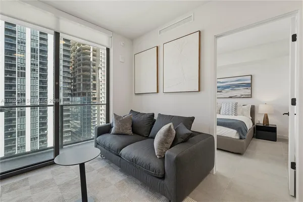 a living room with furniture and a window