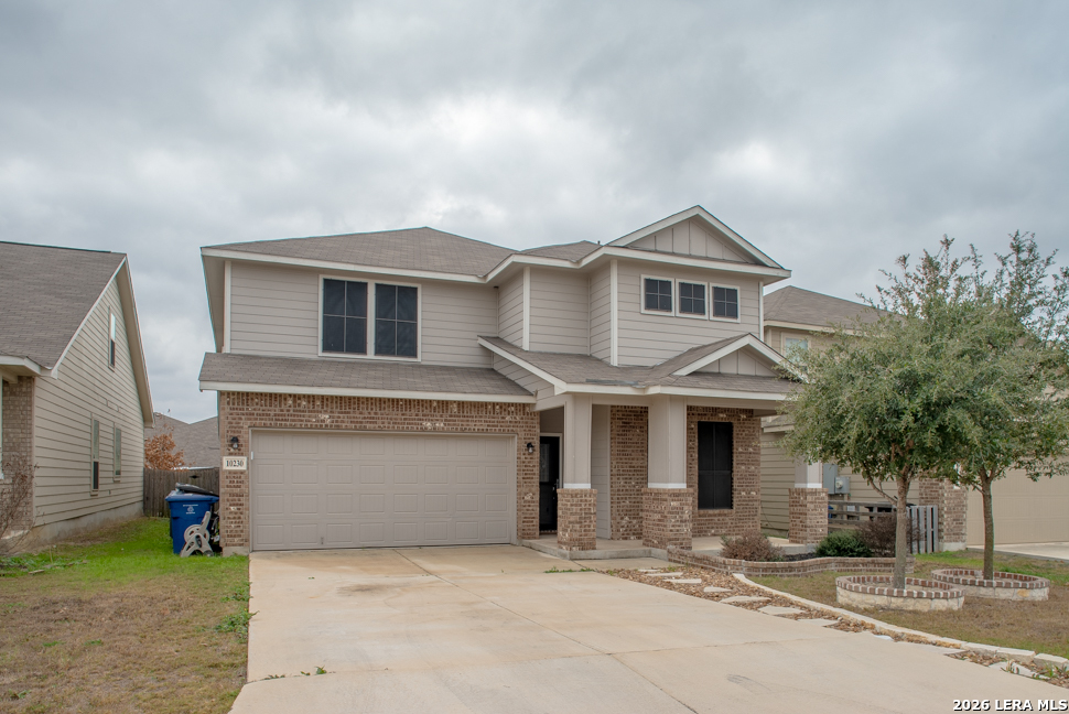 10230 Midsummer Meadow Converse, TX 78109 - Photo 1 of 37 a front view of a house with a garden and tree