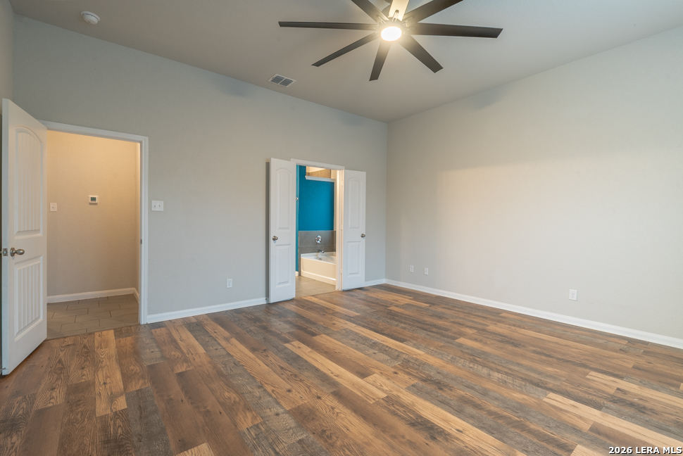 10230 Midsummer Meadow Converse, TX 78109 - Photo 16 of 37 a view of empty room with wooden floor