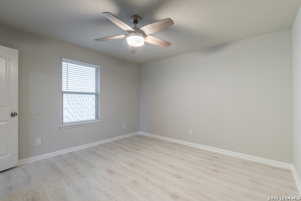 10230 Midsummer Meadow Converse, TX 78109 - Photo 24 of 37 an empty room with wooden floor and windows