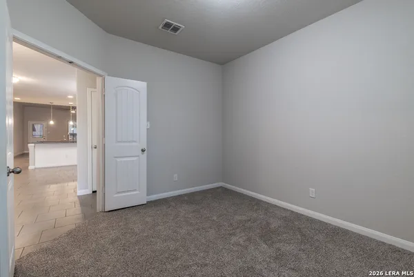 wooden floor and cabinet in an empty room