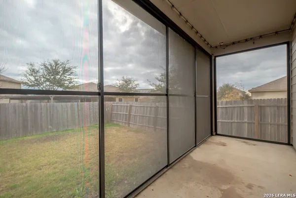 a view of a glass door and an outdoor space