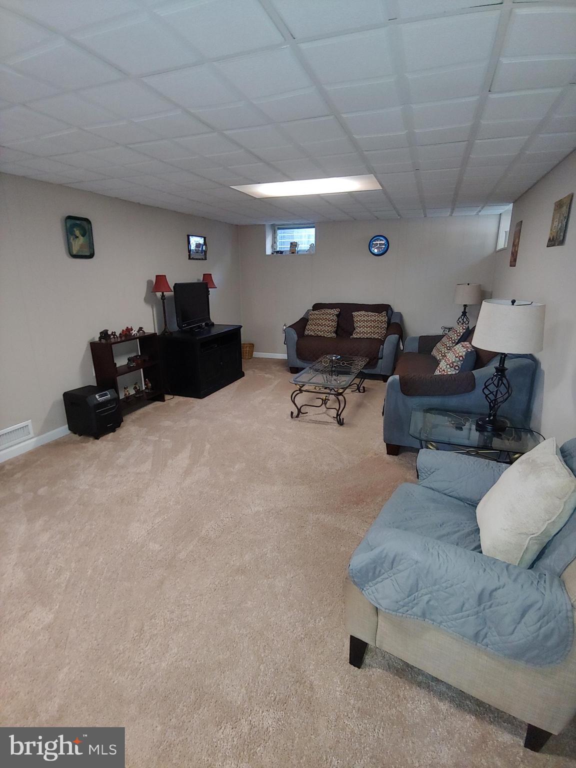547 Joppa Farm Road Joppa, MD 21085 - Photo 19 of 35 FAMILY ROOM WITH CARPET & DROP CEILING