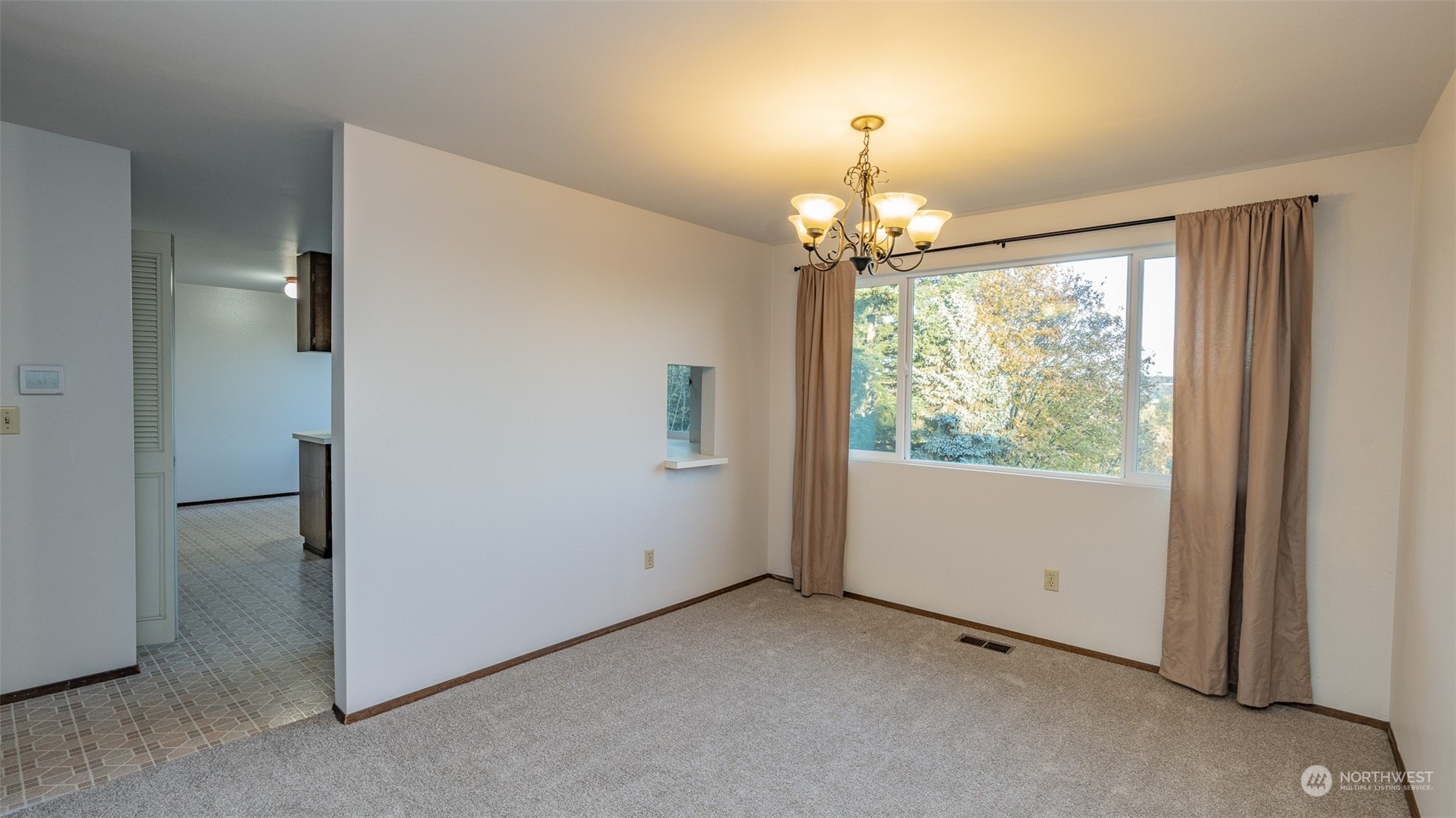 22527 4th Avenue Southeast Bothell, WA 98021 - Photo 17 of 40 a view of a livingroom with a chandelier fan and a window