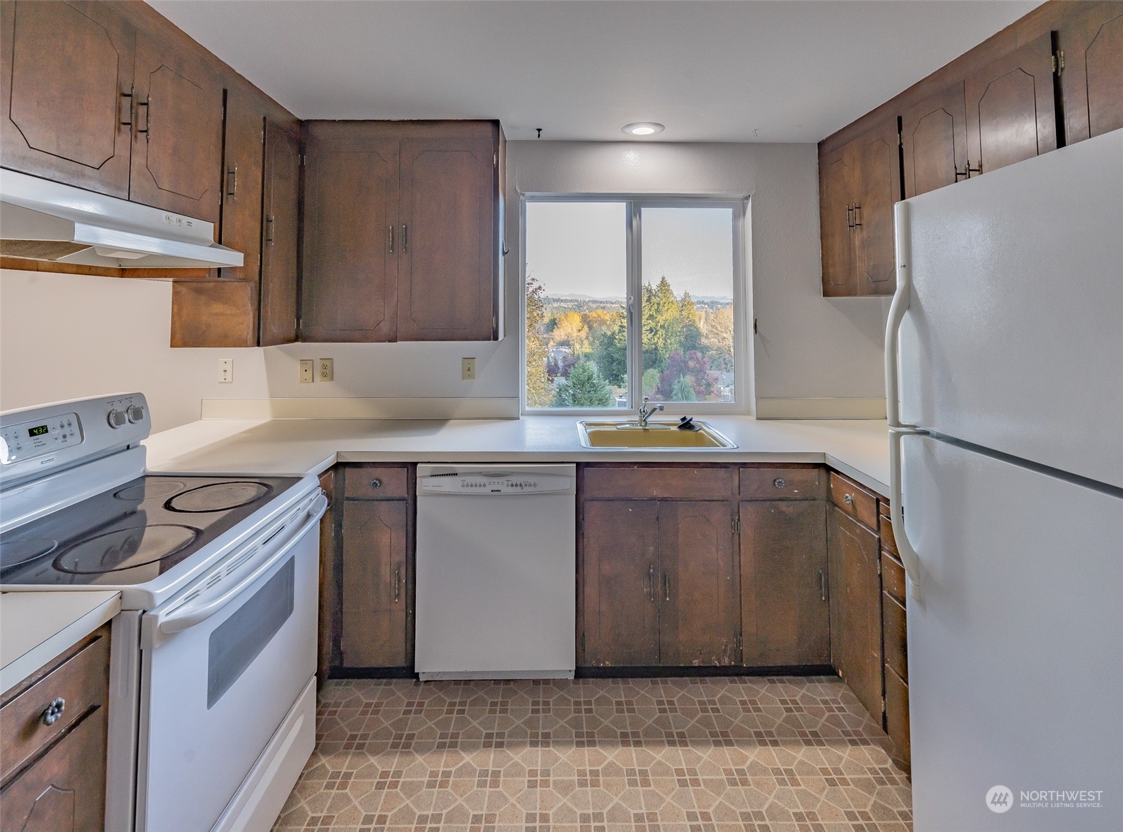 22527 4th Avenue Southeast Bothell, WA 98021 - Photo 20 of 40 a kitchen with stainless steel appliances granite countertop a refrigerator sink and cabinets