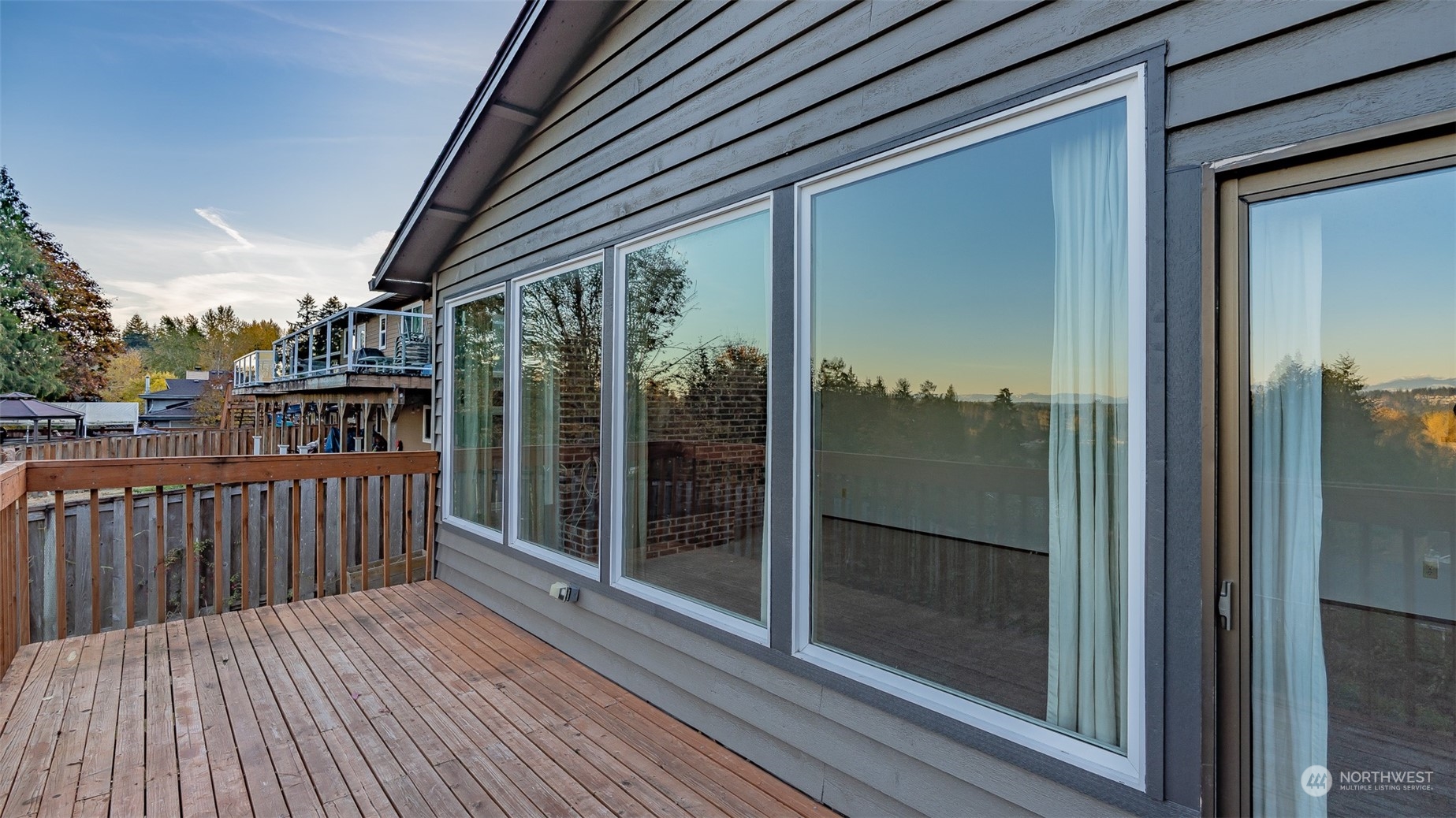 22527 4th Avenue Southeast Bothell, WA 98021 - Photo 35 of 40 a view of a balcony with wooden floor and iron stairs