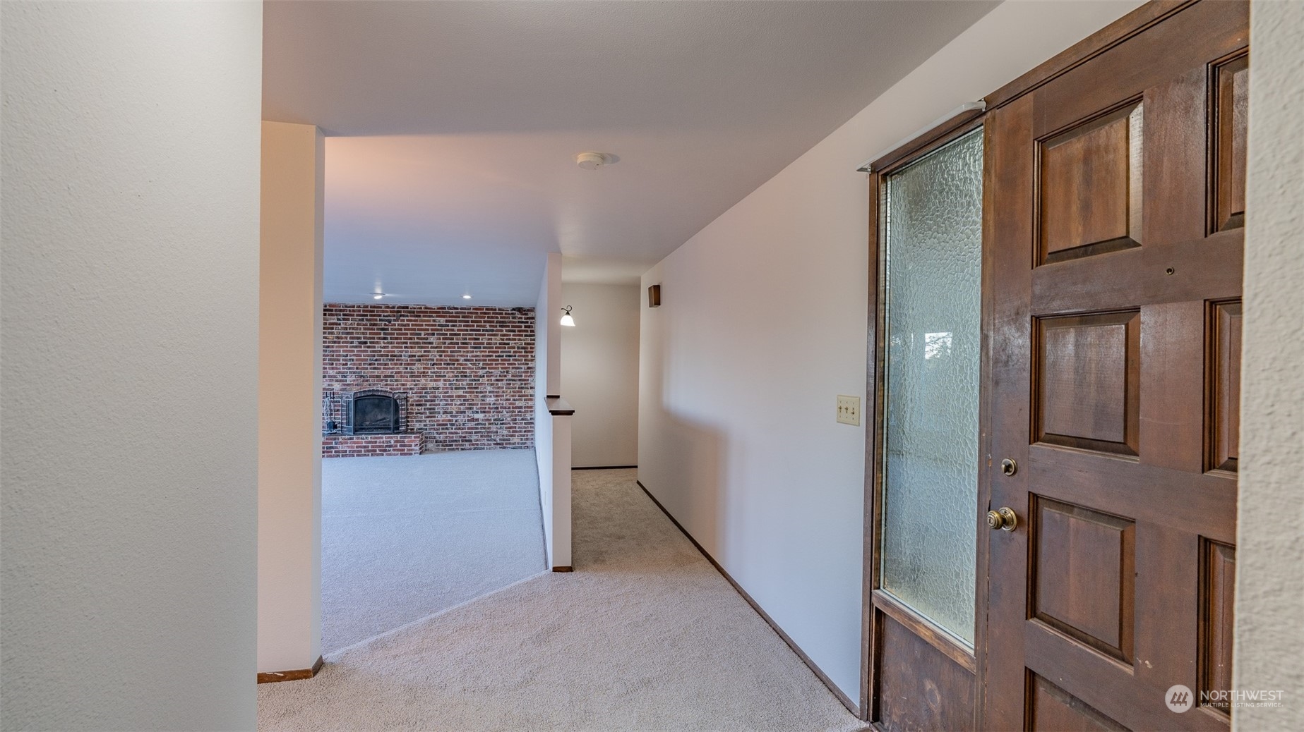 22527 4th Avenue Southeast Bothell, WA 98021 - Photo 9 of 40 a view of a hallway with granite countertop a refrigerator