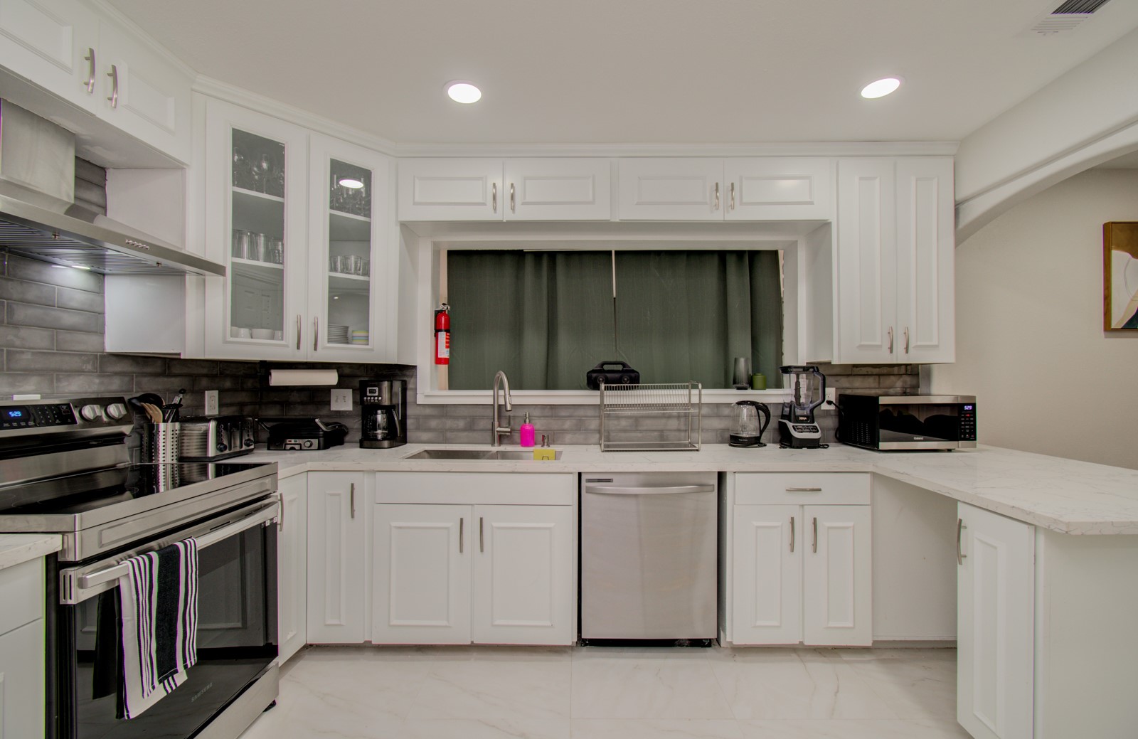 8623 Parasol Lane Houston, TX 77064 - Photo 12 of 50 a kitchen with white cabinets and white appliances
