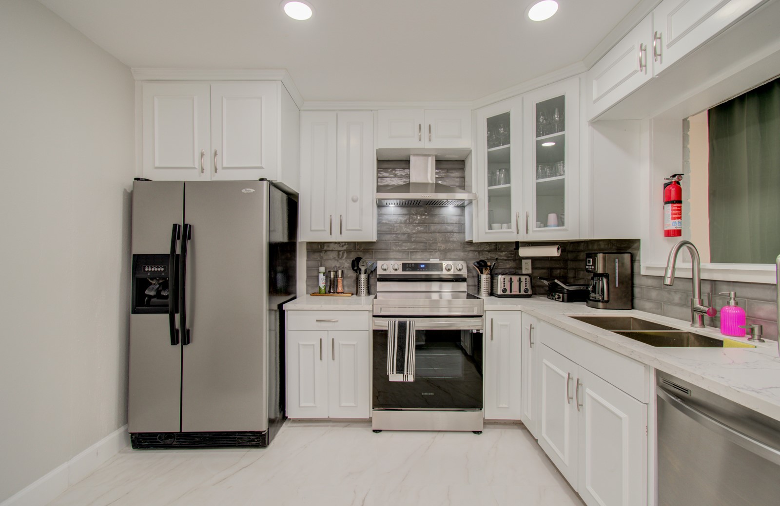 8623 Parasol Lane Houston, TX 77064 - Photo 13 of 50 a kitchen with stainless steel appliances granite countertop a refrigerator sink and stove