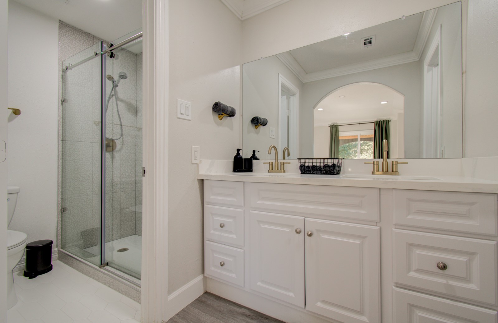 8623 Parasol Lane Houston, TX 77064 - Photo 19 of 50 a bathroom with a shower a sink and a mirror