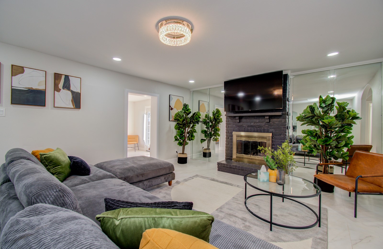 8623 Parasol Lane Houston, TX 77064 - Photo 2 of 50 a living room with furniture a flat screen tv and a fireplace