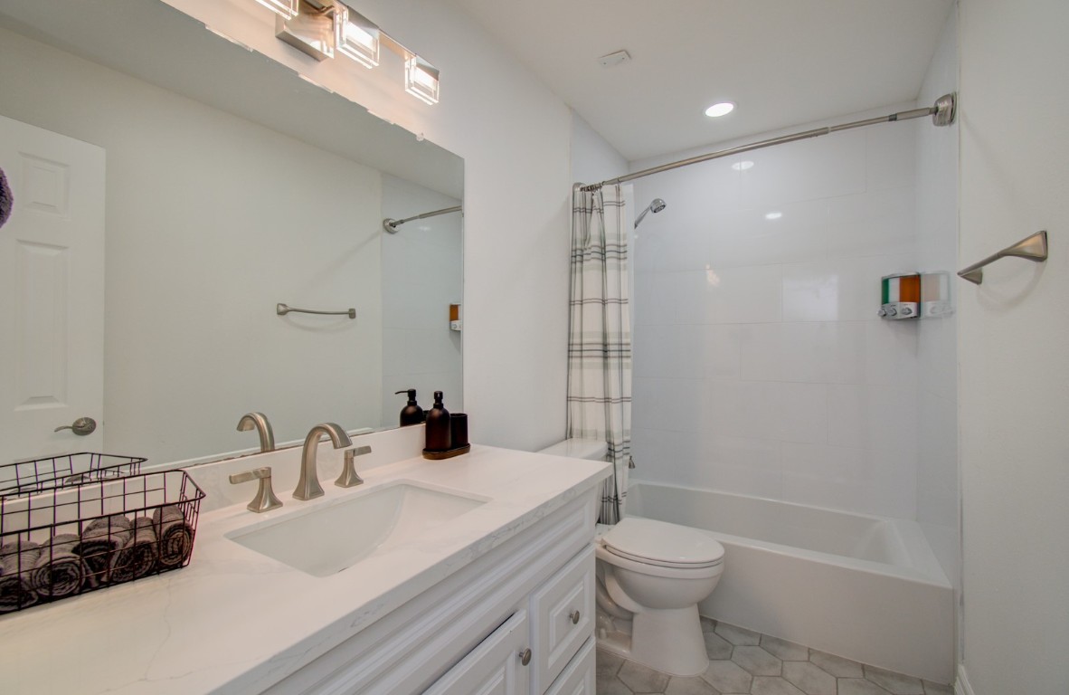 8623 Parasol Lane Houston, TX 77064 - Photo 25 of 50 a bathroom with a granite countertop sink toilet and shower