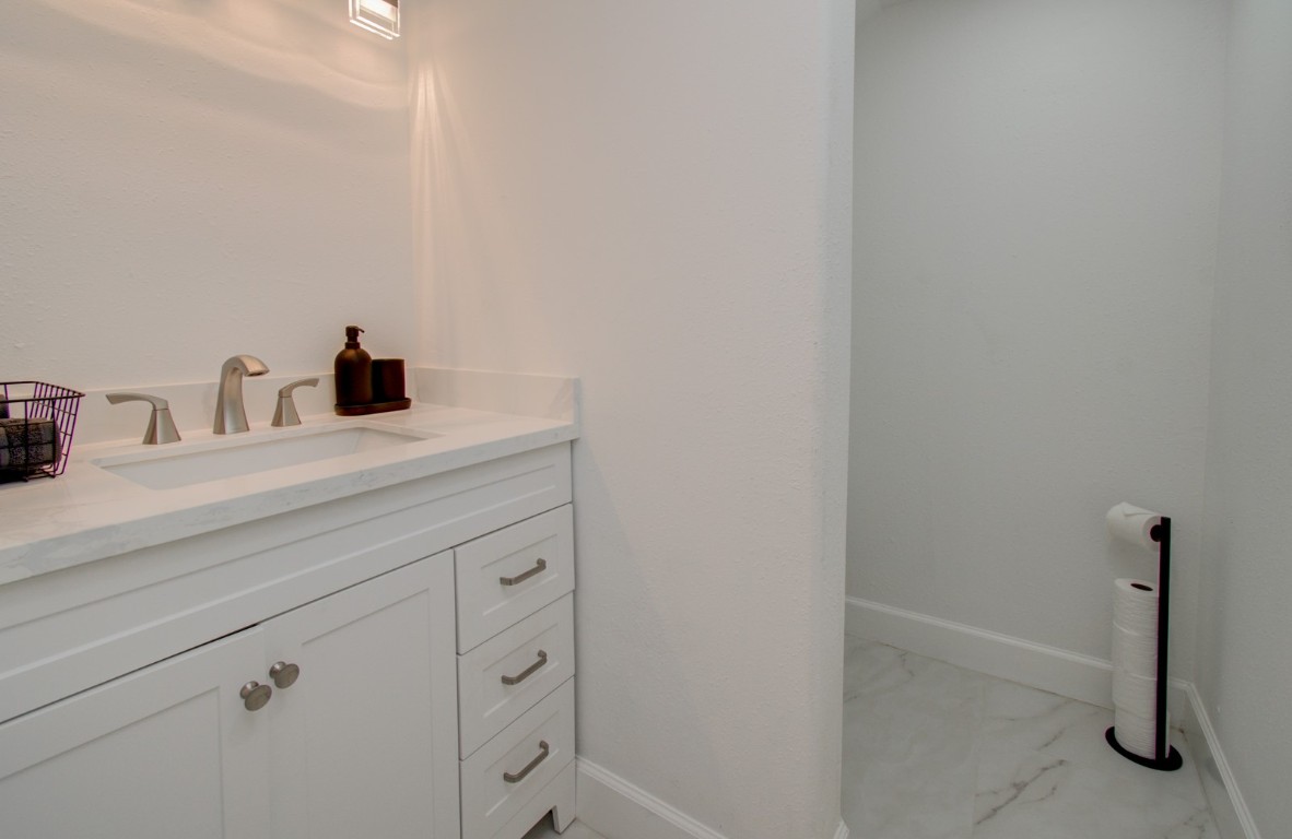 8623 Parasol Lane Houston, TX 77064 - Photo 28 of 50 a bathroom with a sink and a mirror