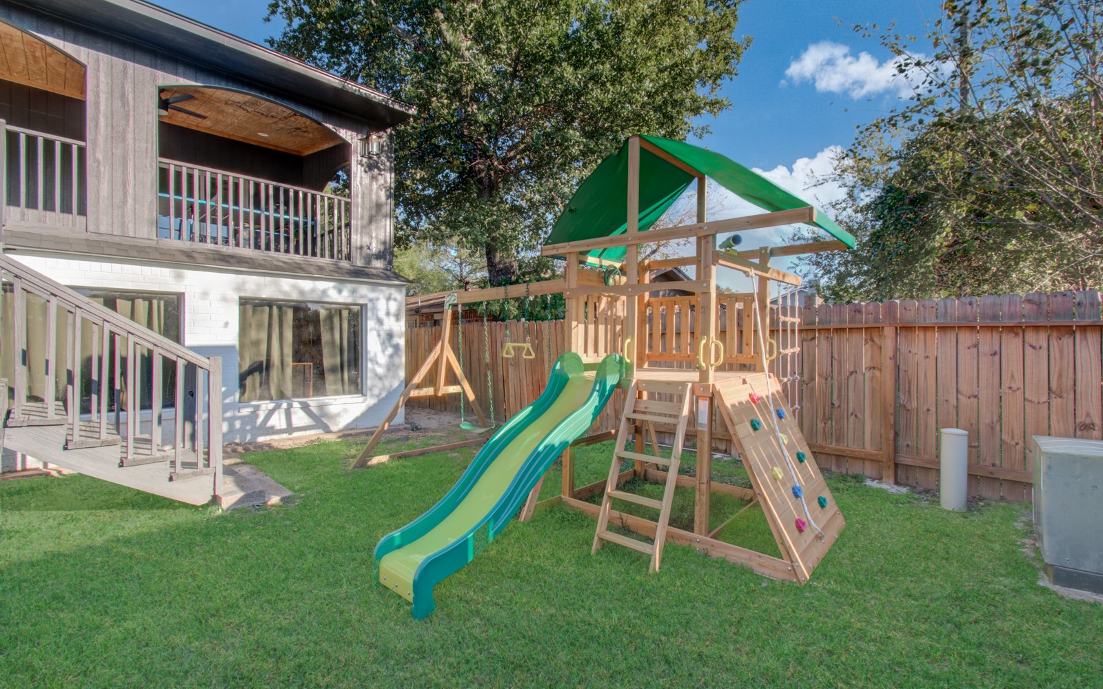 8623 Parasol Lane Houston, TX 77064 - Photo 41 of 50 a view of a house with a slide and wooden fence
