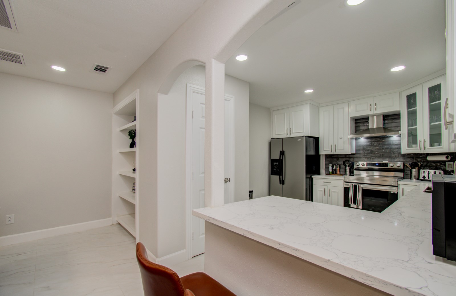 8623 Parasol Lane Houston, TX 77064 - Photo 10 of 50 a kitchen with stainless steel appliances a refrigerator stove microwave and cabinets