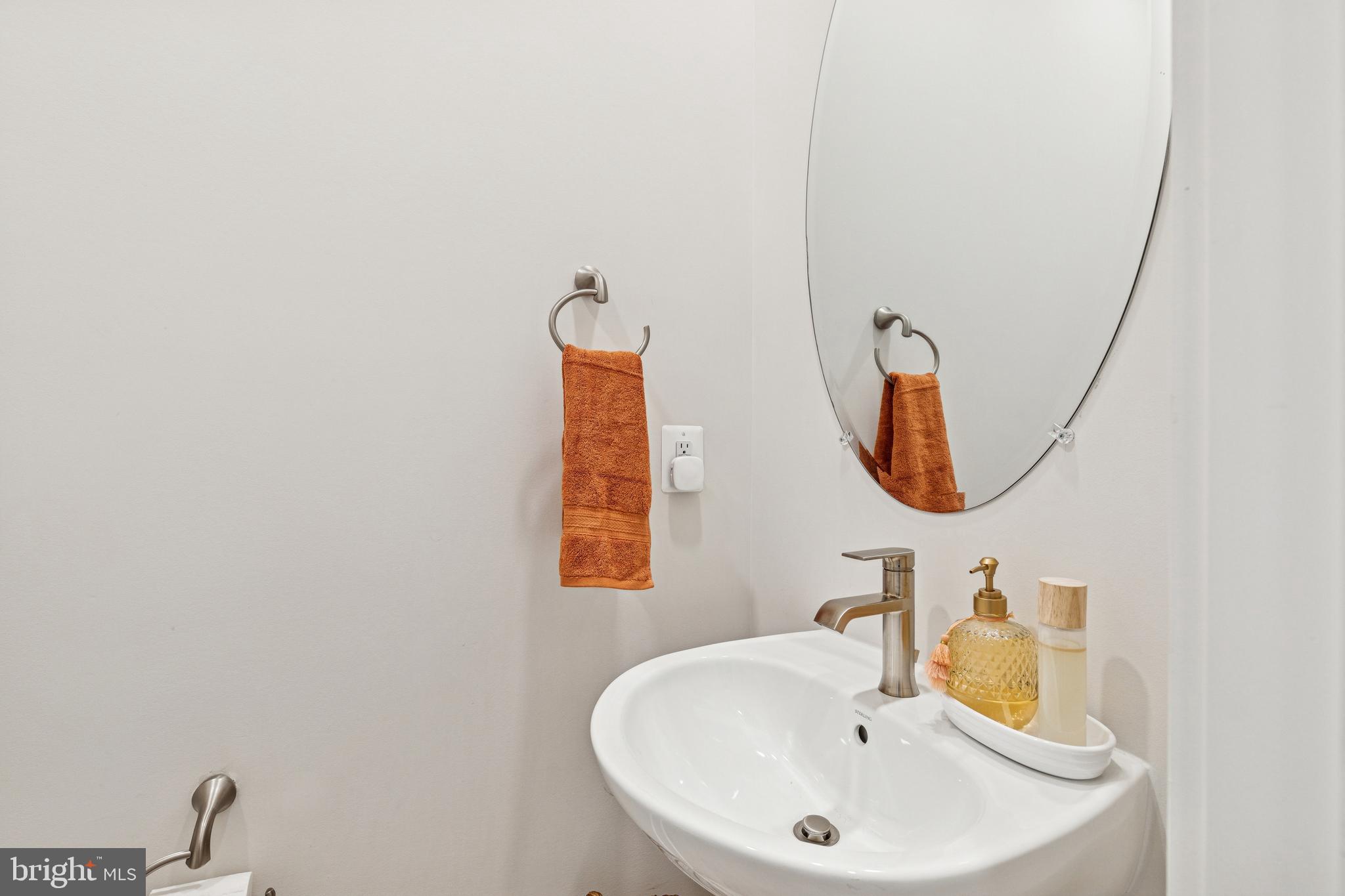 2218 Partin Road Baltimore, MD 21244 - Photo 24 of 62 a bathroom with a sink and a mirror