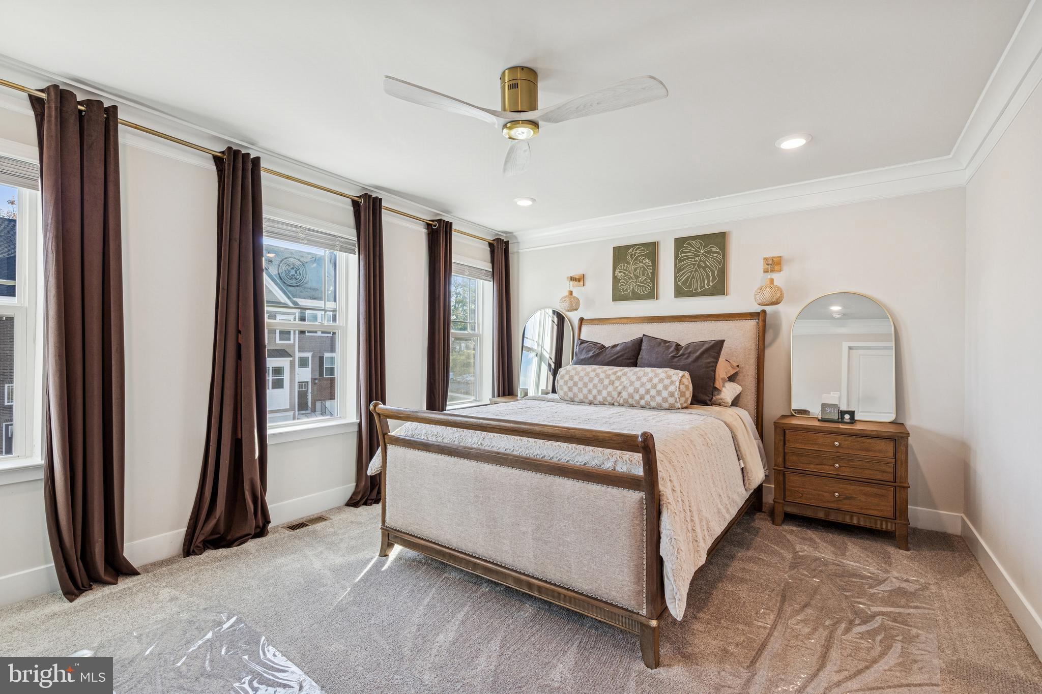 2218 Partin Road Baltimore, MD 21244 - Photo 27 of 62 a bedroom with a large bed and a chandelier