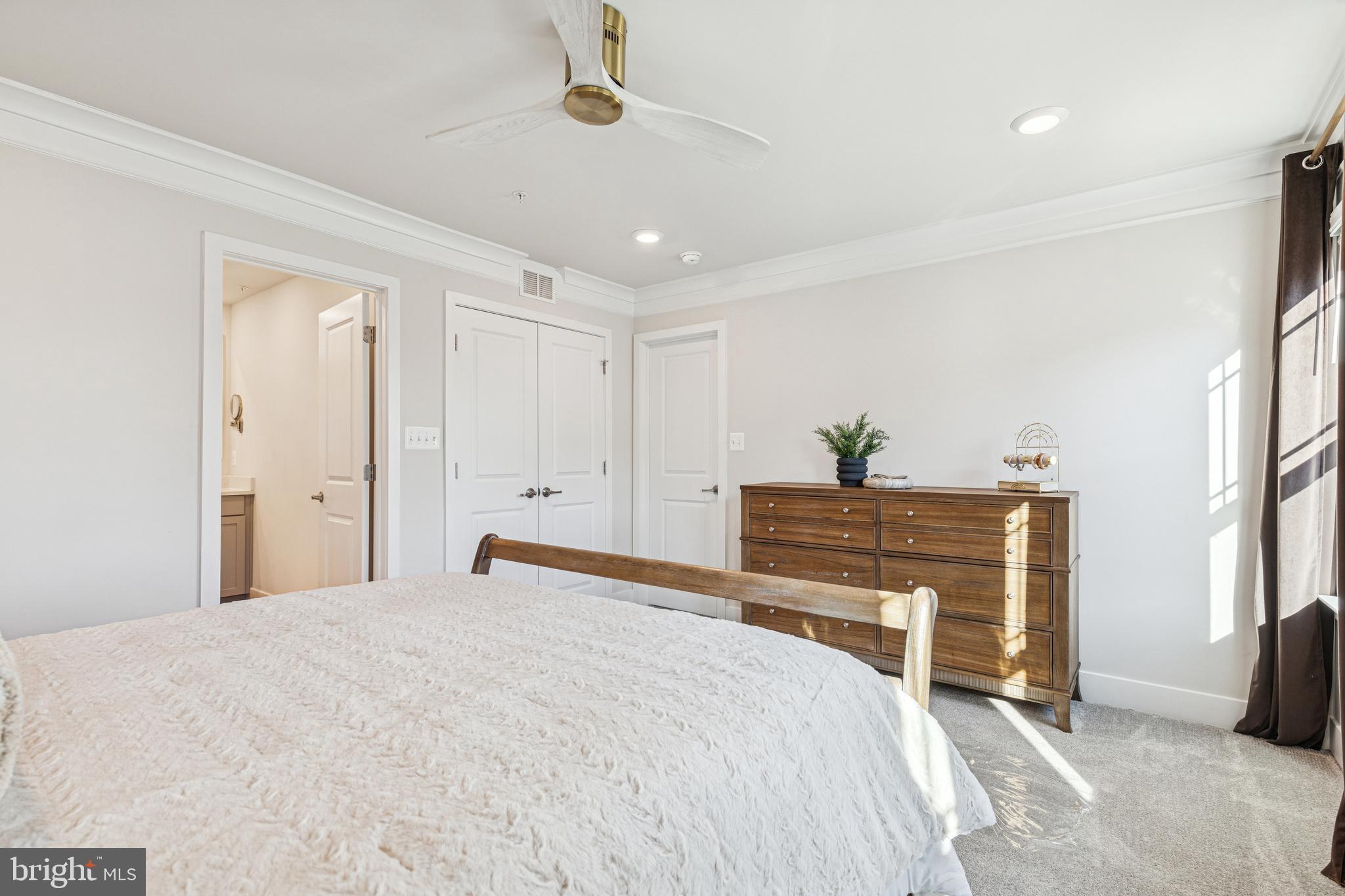 2218 Partin Road Baltimore, MD 21244 - Photo 30 of 62 a bedroom with a bed and a chandelier