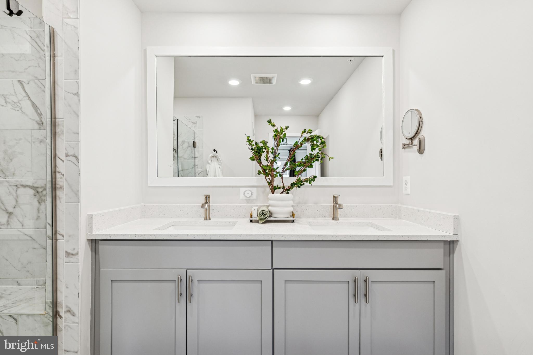 2218 Partin Road Baltimore, MD 21244 - Photo 34 of 62 a bathroom with a sink and a mirror