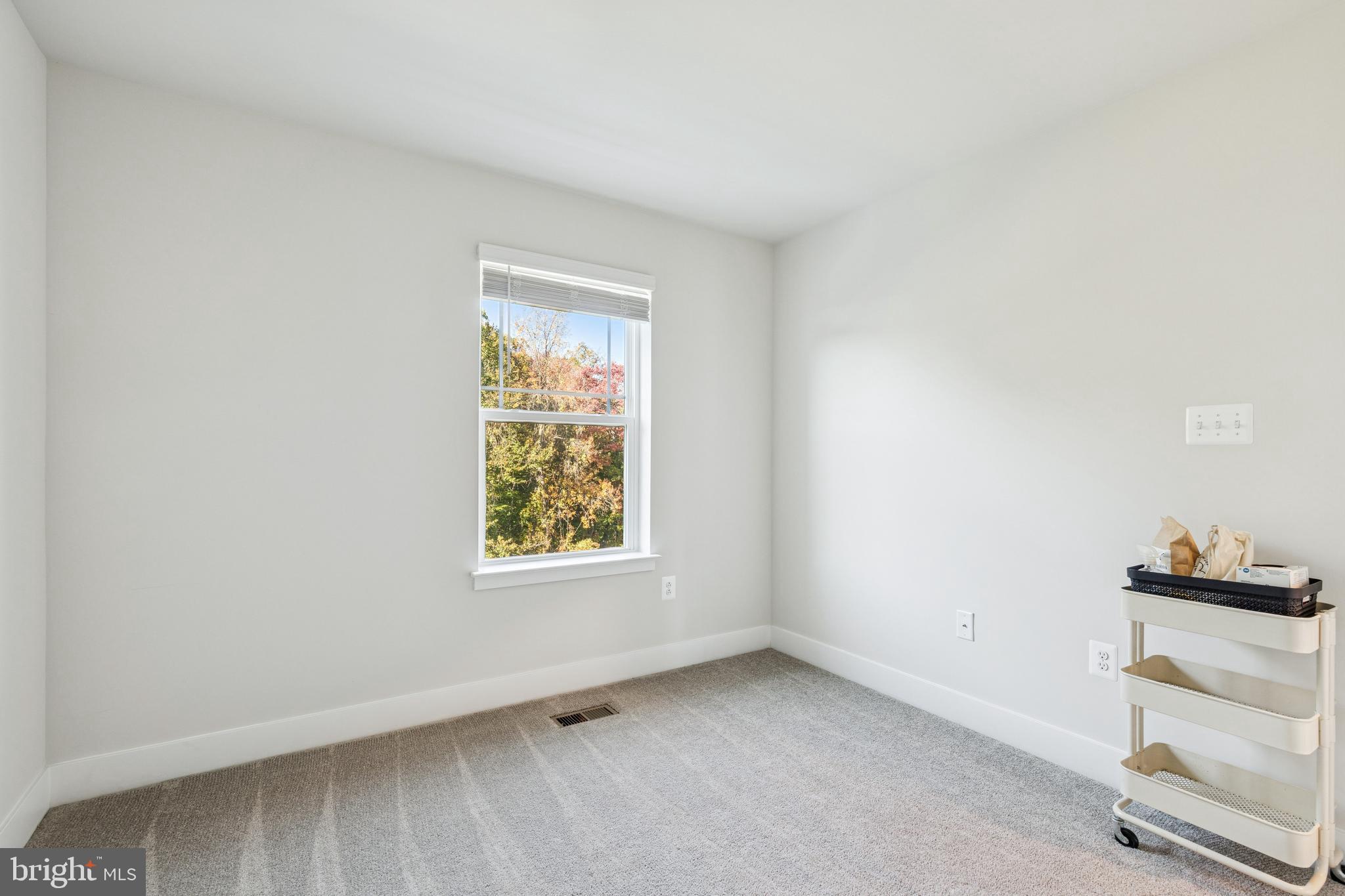 2218 Partin Road Baltimore, MD 21244 - Photo 38 of 62 an empty room with cabinet and windows