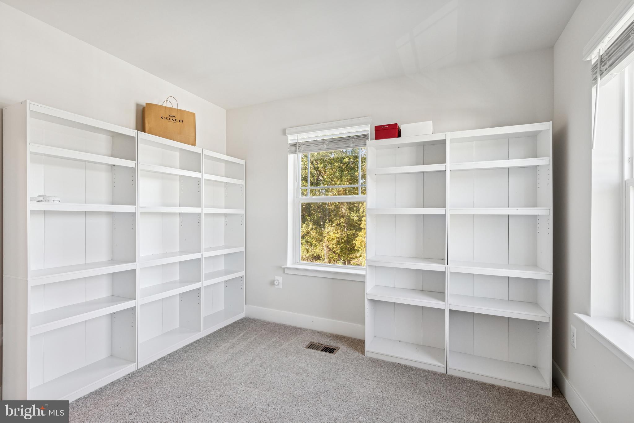 2218 Partin Road Baltimore, MD 21244 - Photo 42 of 62 a view of an empty room with shelves