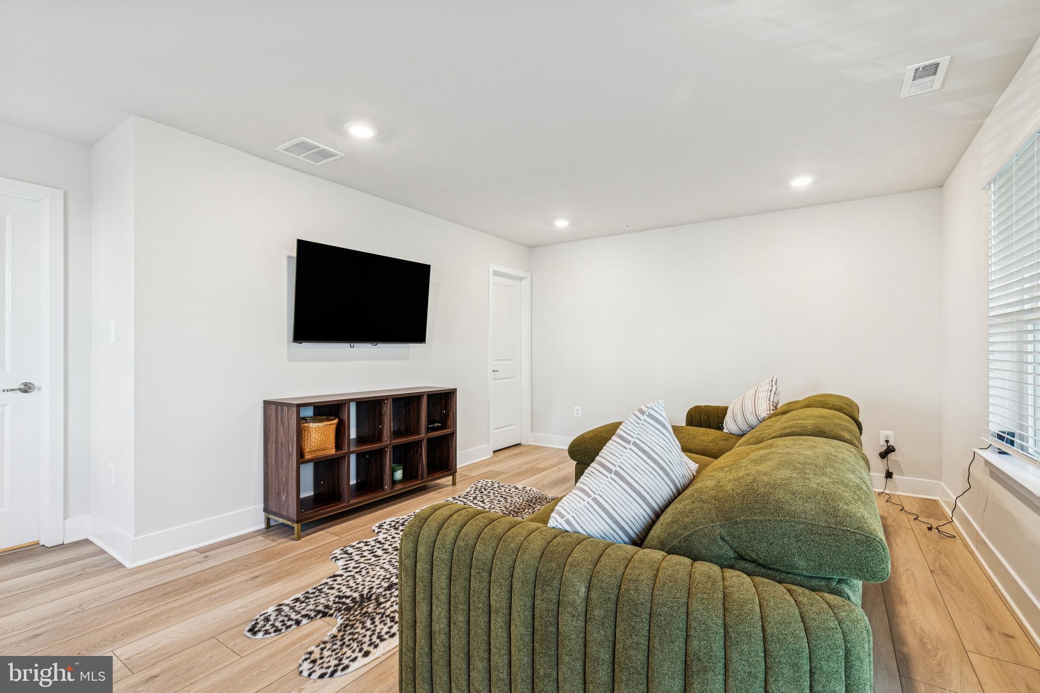 2218 Partin Road Baltimore, MD 21244 - Photo 46 of 62 a living room with furniture and a flat screen tv