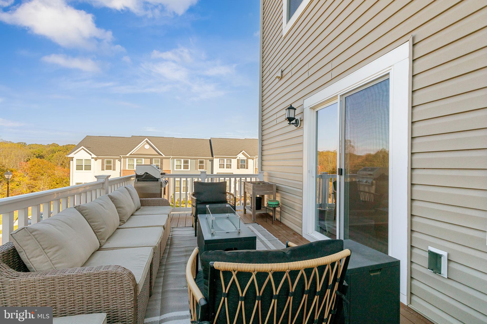 2218 Partin Road Baltimore, MD 21244 - Photo 57 of 62 a balcony with furniture and a potted plant