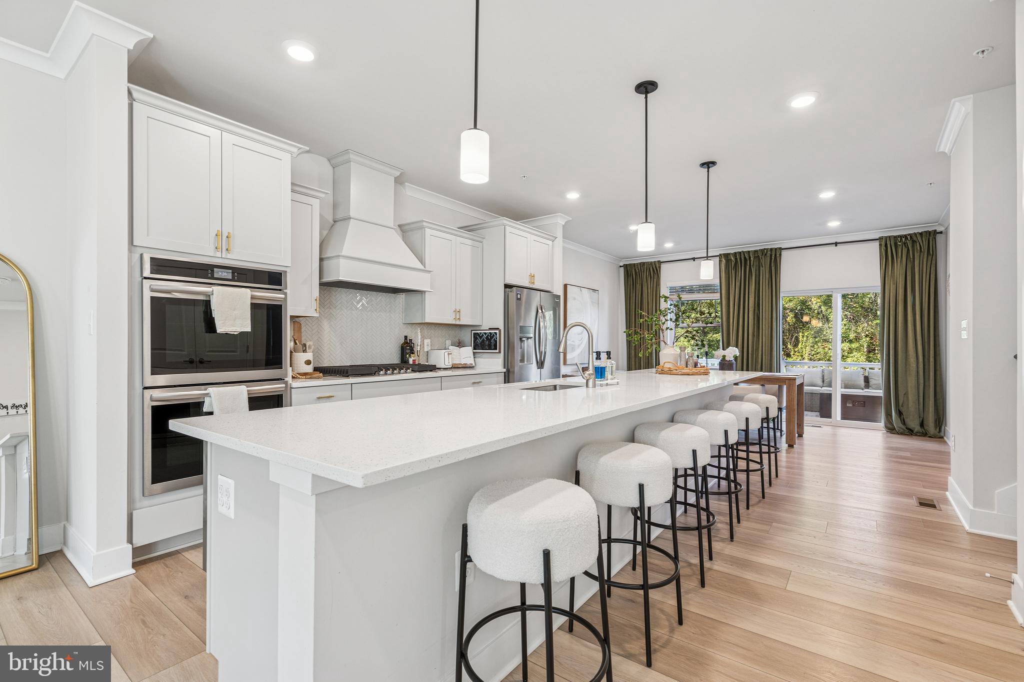 2218 Partin Road Baltimore, MD 21244 - Photo 10 of 62 a large kitchen with kitchen island a large island in it