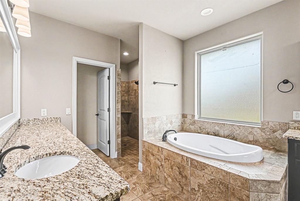 104 Stanford Lane Springtown, TX 76082 - Photo 17 of 28 a bathroom with a granite countertop sink and a mirror