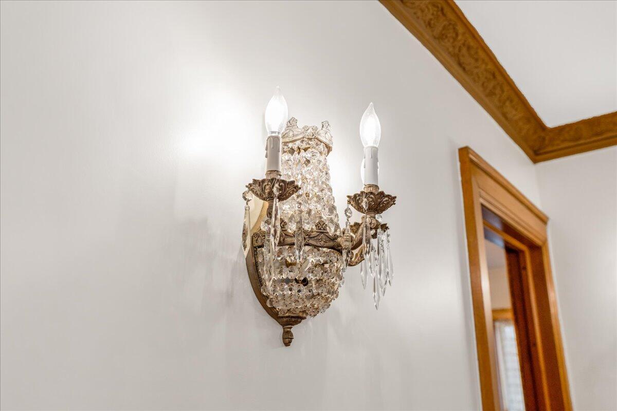 461 5th Street Manistee, MI 49660 - Photo 51 of 89 Crystal sconces line the walls