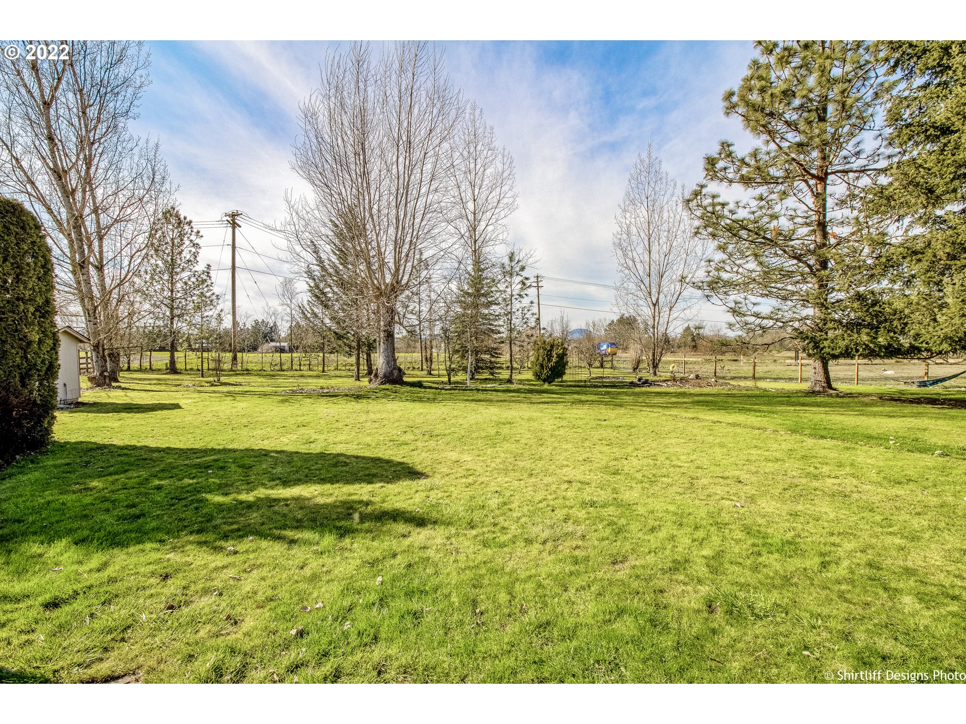 83553 Cloverdale Road Creswell, OR 97426 - Photo 12 of 17 a view of swimming pool with an outdoor space and seating