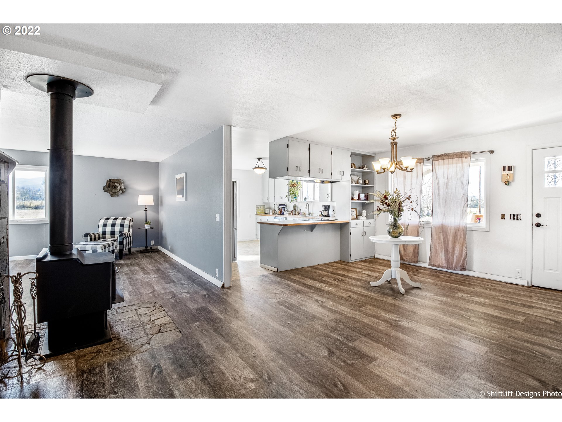 83553 Cloverdale Road Creswell, OR 97426 - Photo 5 of 17 a living room with kitchen island granite countertop furniture and a dining table