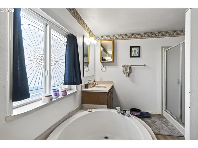 a bedroom with a bed and glass door