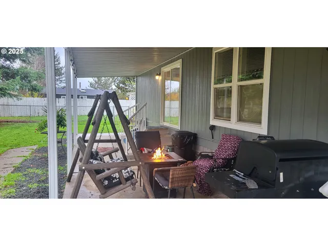a view of a backyard with a garden and plants