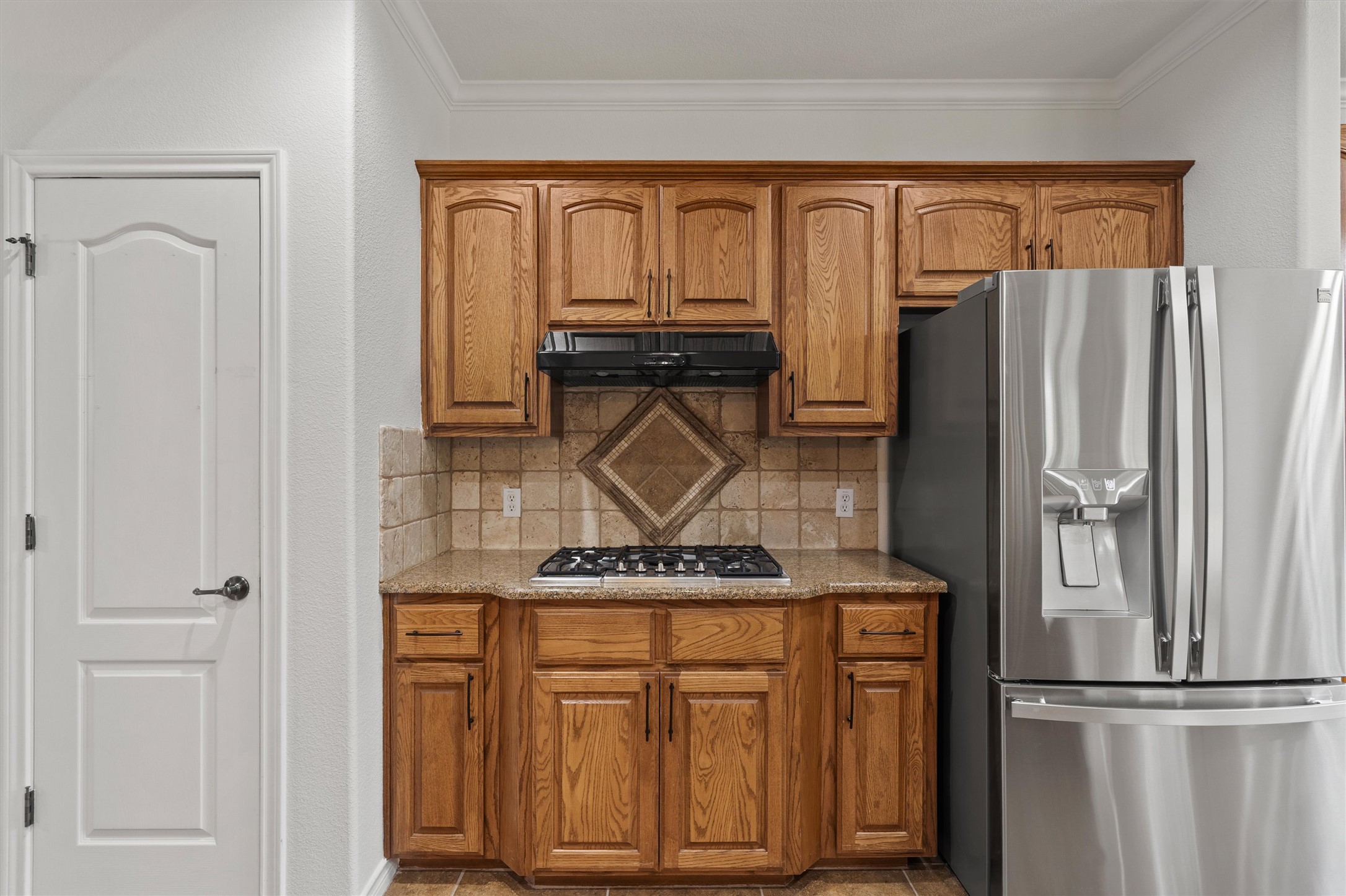 4612 Sonora Trace Georgetown, TX 78633 - Photo 23 of 36 a kitchen with stainless steel appliances granite countertop a refrigerator and a stove top oven