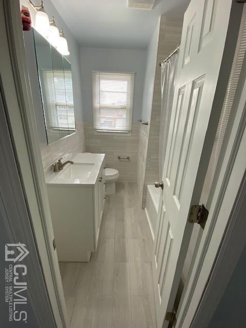 470 Old Post Road Edison, NJ 08817 - Photo 8 of 27 a bathroom with sink a mirror a window and vanity