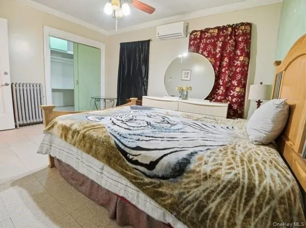 a bed room with a bed and a chair