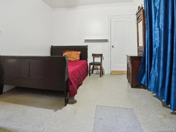 a bedroom with furniture and a rug