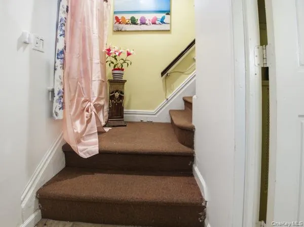 a bedroom with a bed and a view of bathroom
