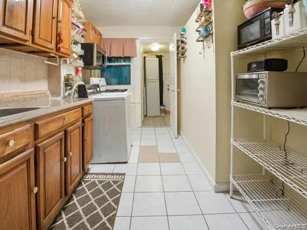 a kitchen with stainless steel appliances a refrigerator sink and cabinets