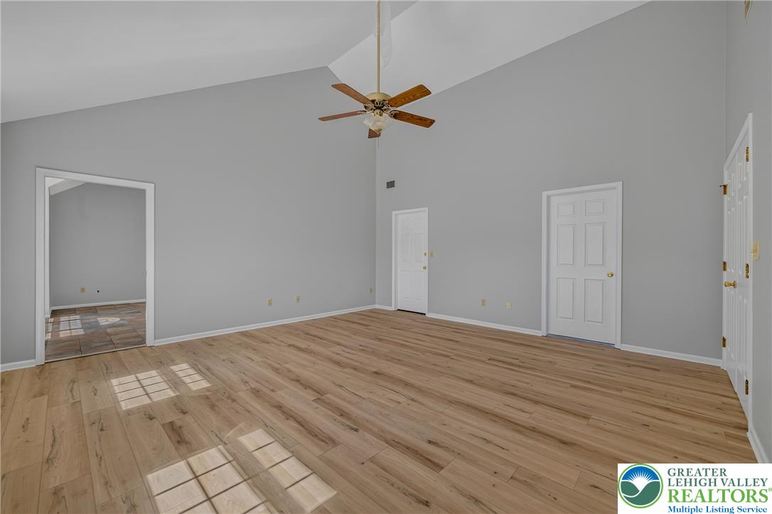 630 Clearfield Road Nazareth, PA 18064 - Photo 48 of 100 Vaulted ceilings soar over durable wood-look flooring in this versatile interior space.