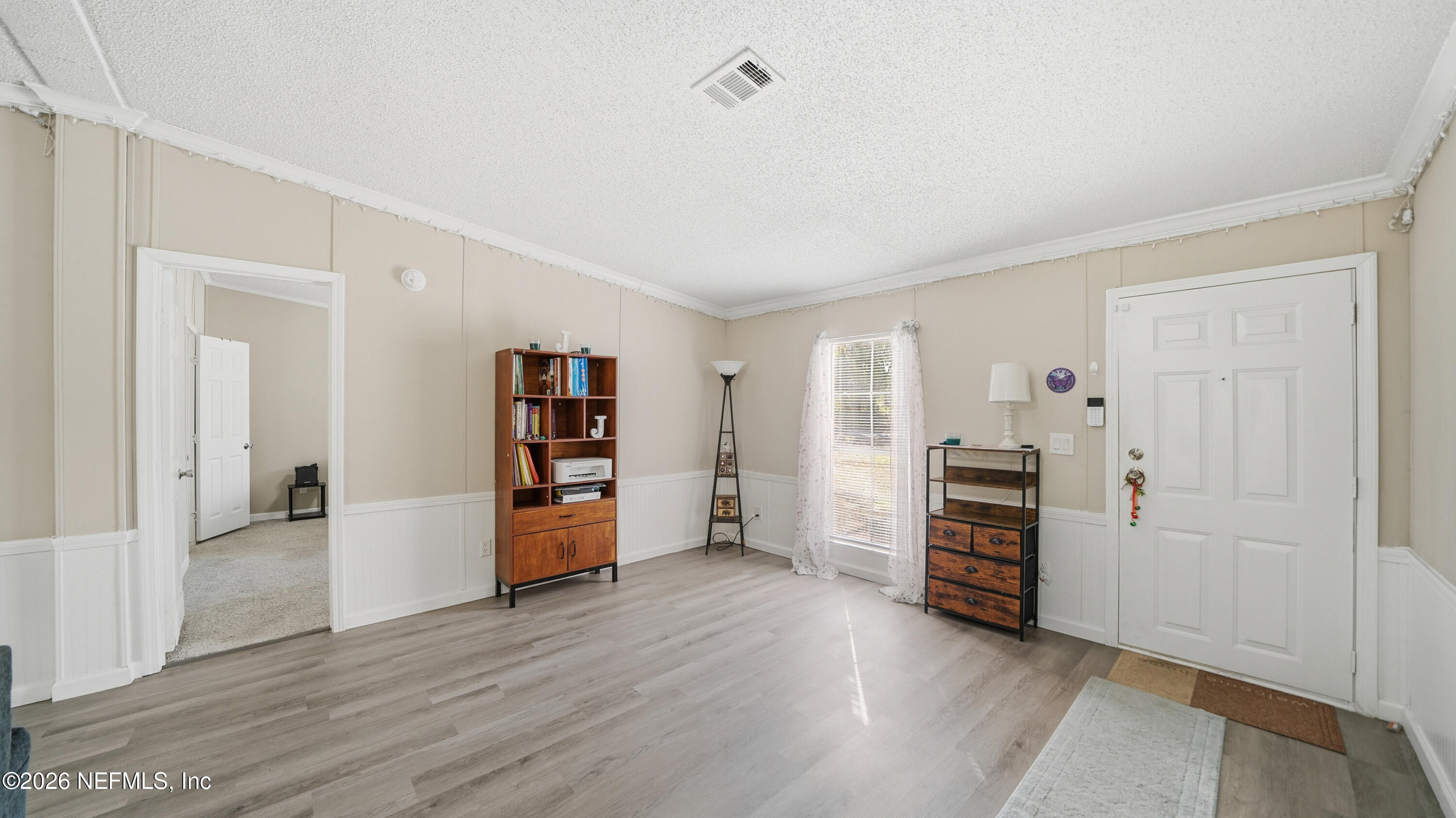 85324 Lil William Road Fernandina Beach, FL 32034 - Photo 2 of 36 an empty room with a wooden floor and closet