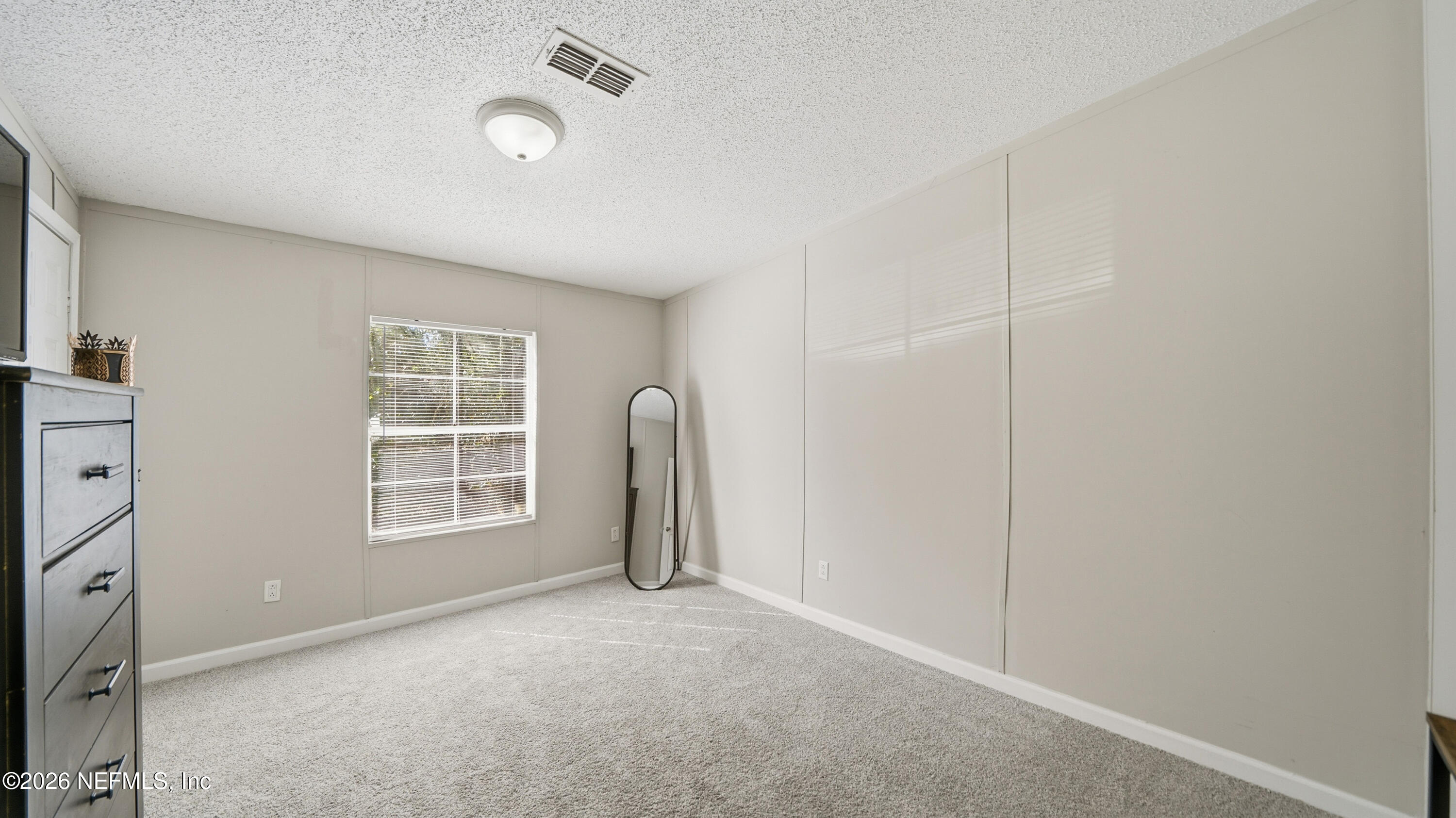 85324 Lil William Road Fernandina Beach, FL 32034 - Photo 21 of 36 an empty room with windows and closet