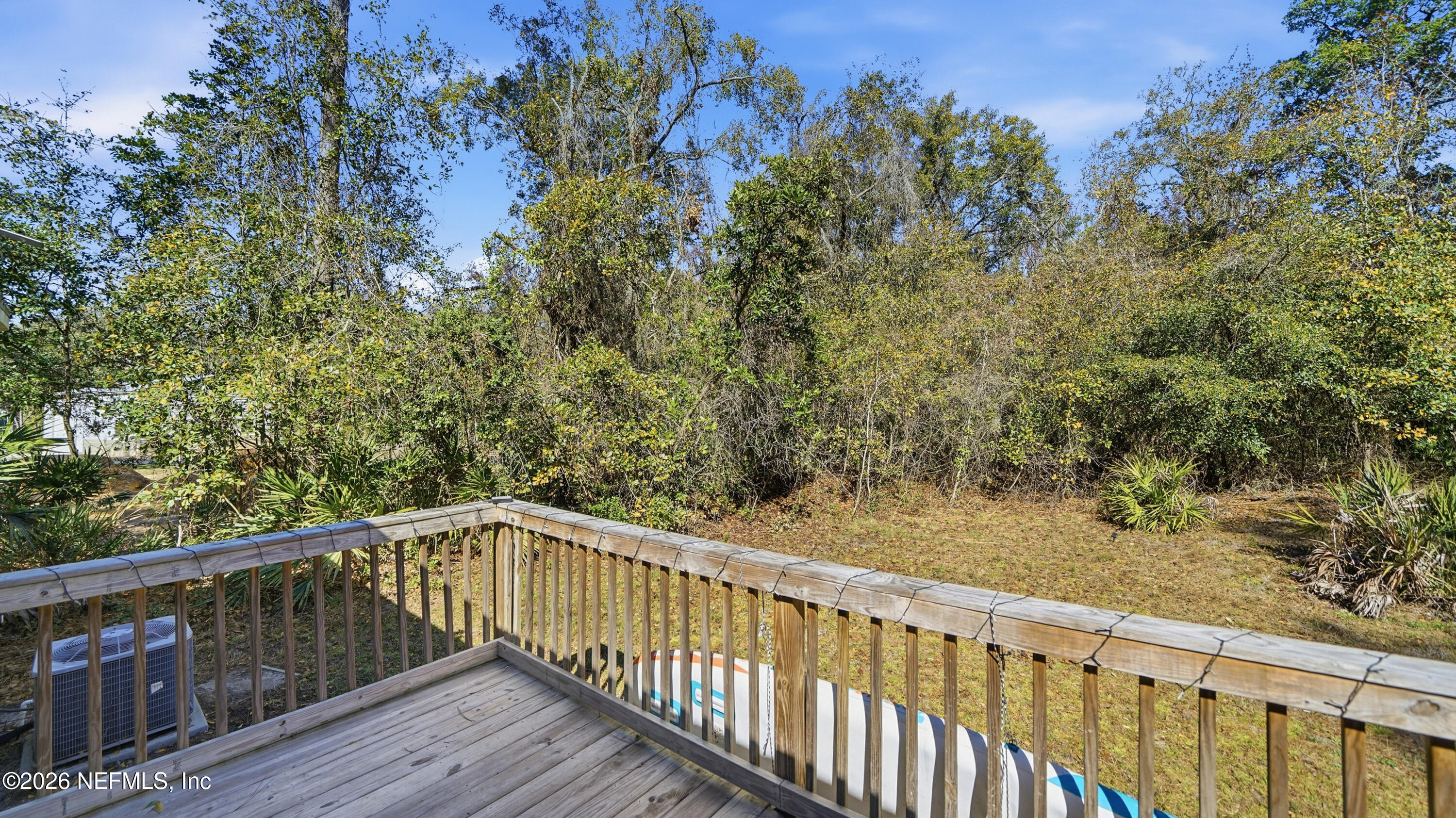 85324 Lil William Road Fernandina Beach, FL 32034 - Photo 28 of 36 a balcony with wooden floor and fence